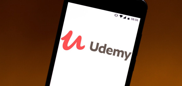 A Udemy logo seen displayed on a smartphone.