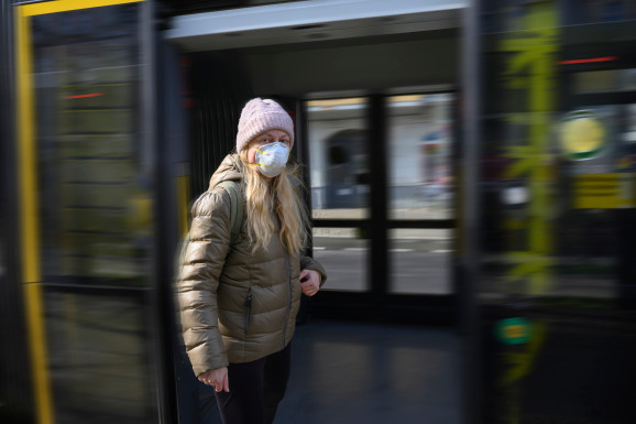 Woman with protective mask on the street