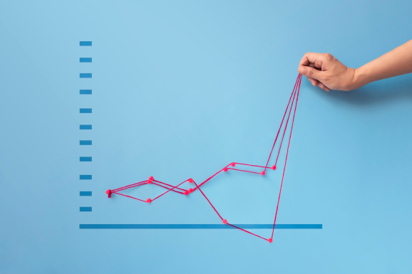 Hand pulling up graph showing various growth/decline scenarios