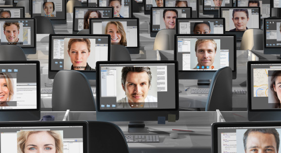 Many computers with peoples faces on each screen