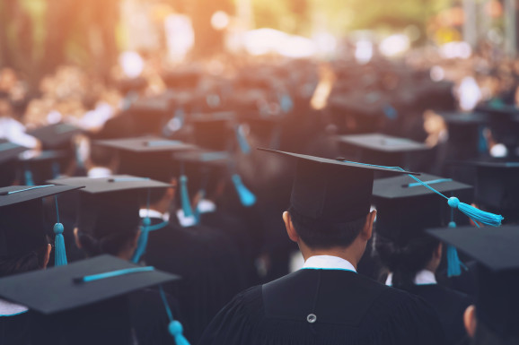 University Students Wearing Mortarboards During Event