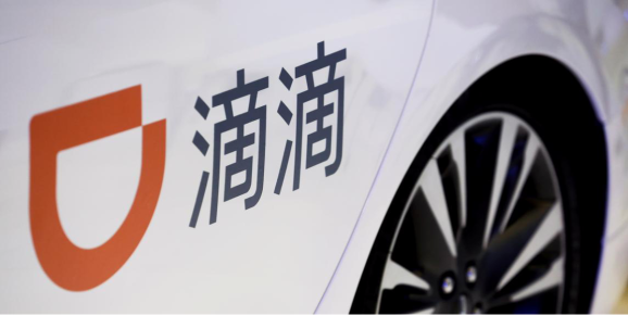 The company logo of the Didi ride-hailing app on a car door at the IEEV New Energy Vehicles Exhibition in Beijing, China, October 18, 2018.