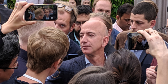 Amazon CEO Jeff Bezos answers questions from reporters at an Alexa event at company headquarters in Seattle, Washington