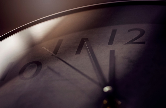 A clock at a few minutes to midnight