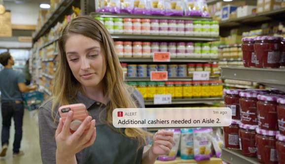 A store clerk responds to an alert from Microsoft Dynamics 365