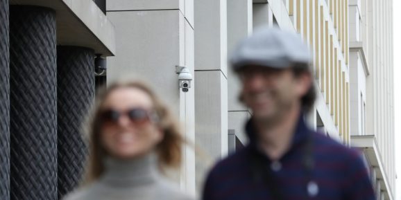 LONDON, ENGLAND - AUGUST 16: People walk past a CCTV camera in Pancras Square near Kings Cross Station on August 16, 2019 in London, England. CCTV cameras using facial-recognition systems at King's Cross are to be investigated by the UK's data-protection watchdog after a report by the Financial Times. (Photo by Dan Kitwood/Getty Images)