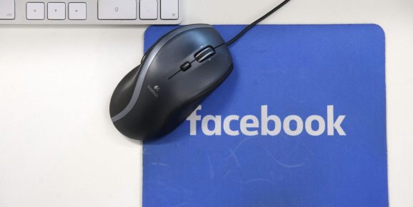 A mousepad with the Facebook logo is seen at Facebook's new headquarters, designed by Canadian-born American architect Frank Gehry, at Rathbone Place in central London on December 4, 2017.